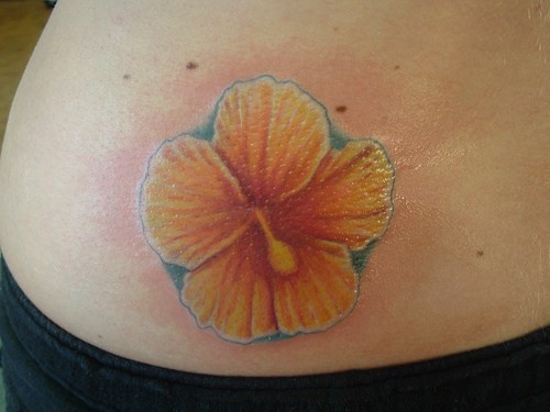 Tattoo of yellow hibiscus flower