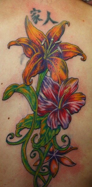 Tattoo of lilies with hieroglyphs