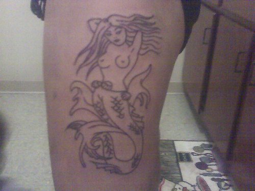 Undone tattoo of mermaid
