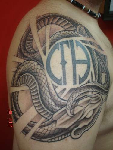 Snake with symbols tattoo