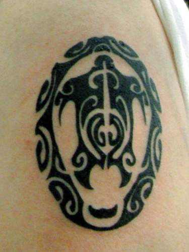 Tribal black tattoo of turtle in the circle
