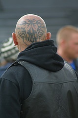 Tattoo on head, wide pattern of black  branching