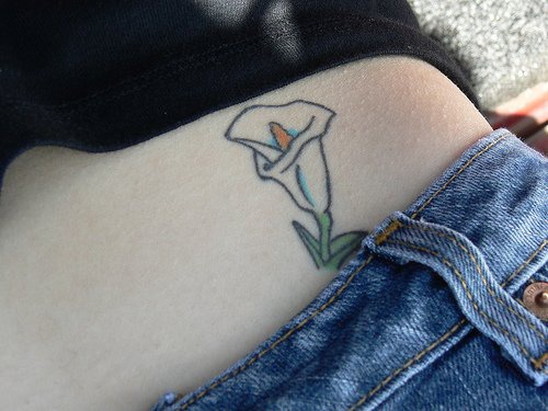 Tattoo on the stomach,white  calla lily