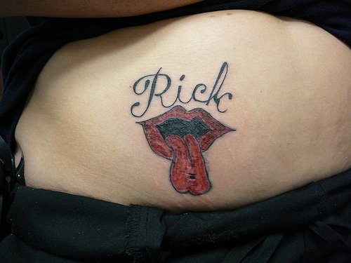Tattoo on the stomach, rick, tongue sticking, red lips