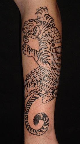 Tiger in armor black ink tattoo