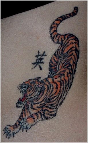 Asian tiger with hieroglyph tattoo