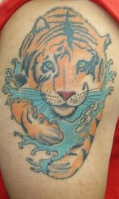 Tiger in waves coloured tattoo