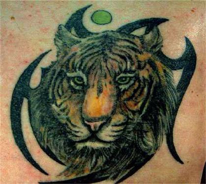 Tiger head on tribal  tattoo