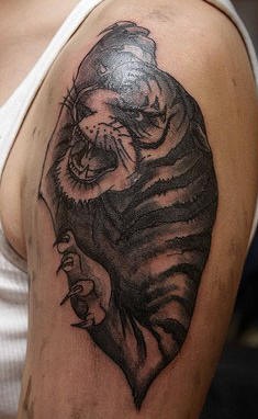 Highly detailed black ink tiger tattoo
