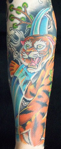 Asian style tiger on waterfall tattoo