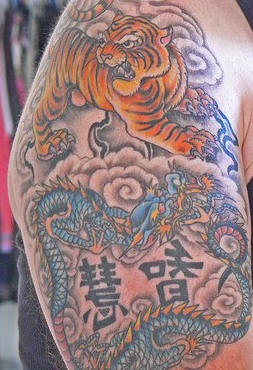 Tiger and dragon in clouds tattoo