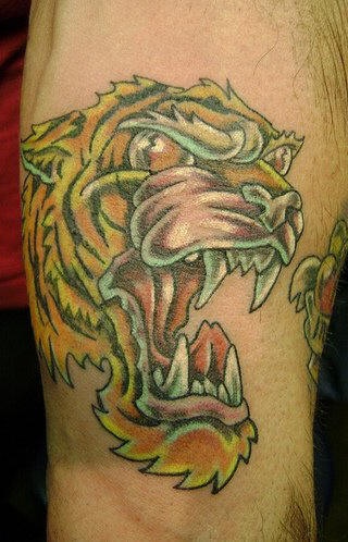 Angry asian tiger tattoo