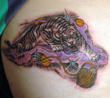 Tiger crawling through space tattoo