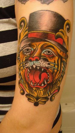 Old school tiger in hat tattoo