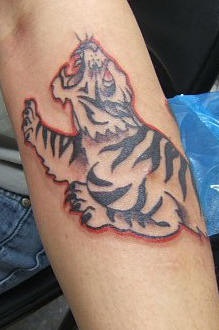 Crawling snow tiger tattoo