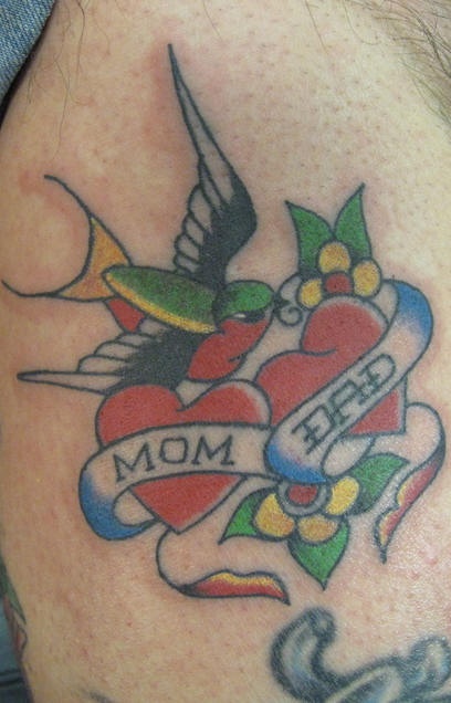 Traditional heart tattoo with bird and inscription mom dad