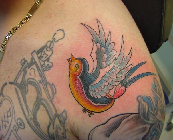 Small colored traditional sparrow tattoo