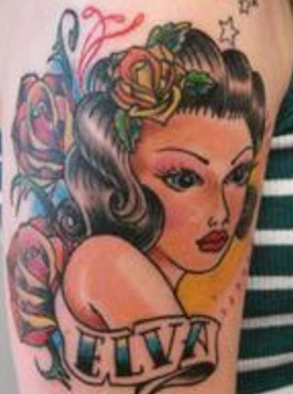 Traditional style pin up tattoo of girl and name inscription
