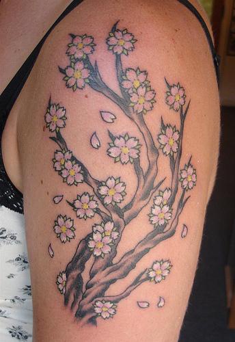 Tree tattoo with nice white blossoms