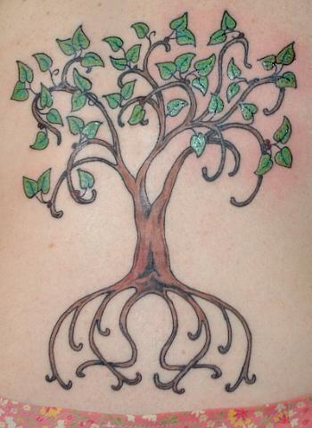 Tree tattoo with green leaves and long root