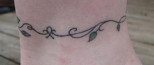 Bracelet tree tattoo with small leaves