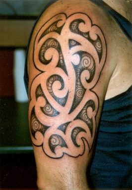 Tribal shoulder tattoo with interesting design