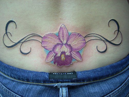 Flower lower back tattoo, styled  iris