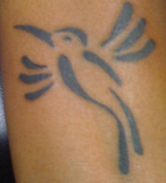 Minimalistic tribal hummingbird tattoo