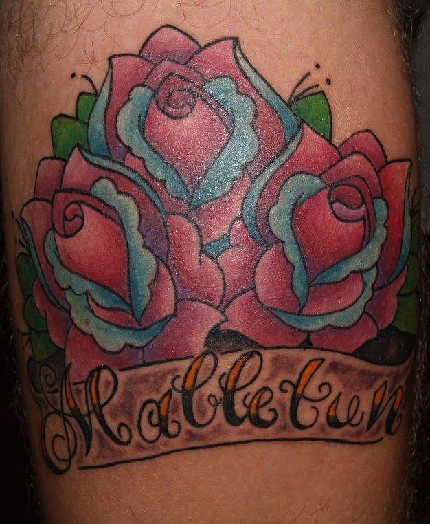 Leg tattoo, malletun, designed inscription, three roses