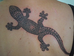 Lizard with tribal pattern tattoo