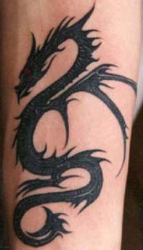 Black tribal tattoo of dragon with red eyes