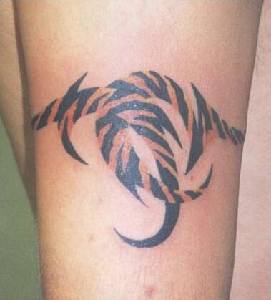 Tribal bracelet tattoo in tiger color