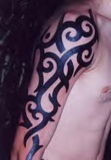 Tribal arm tattoo with thick curved lines