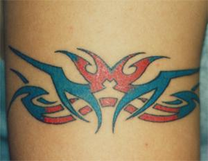 Blue and red tribal sign tattoo