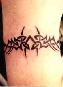 Black ink tribal bracelet tattoo