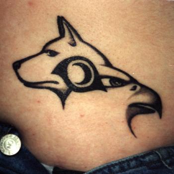 Tattoo of wolf, eagle and tribal sign