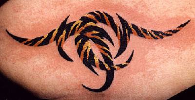 Small tribal tattoo in tiger fur color
