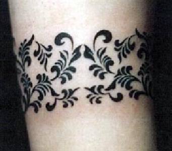 Black ink floral bracelet tattoo