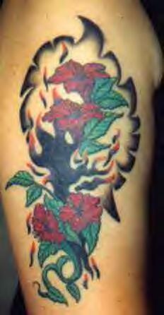 Tribal tattoo with red and green flowers