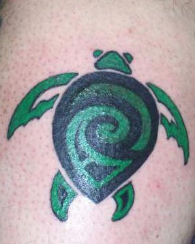 Green and black small tribal turtle tattoo