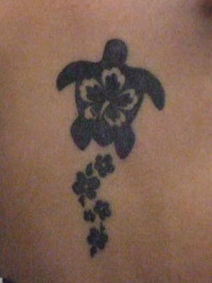 Turtle tattoo of black turtle and flowers