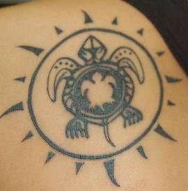 Black turtle tattoo in sun circle