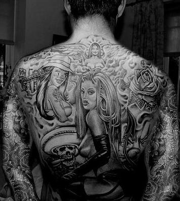 On upper back world of beauties tattoo