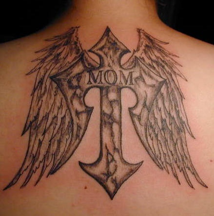 Black designed cross tattoo  on upper back with wings