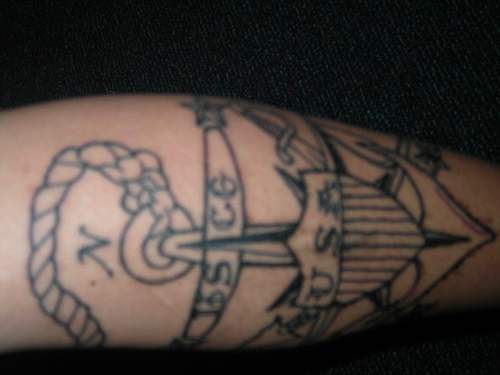 Us navy symbol with anchor and shield tattoo