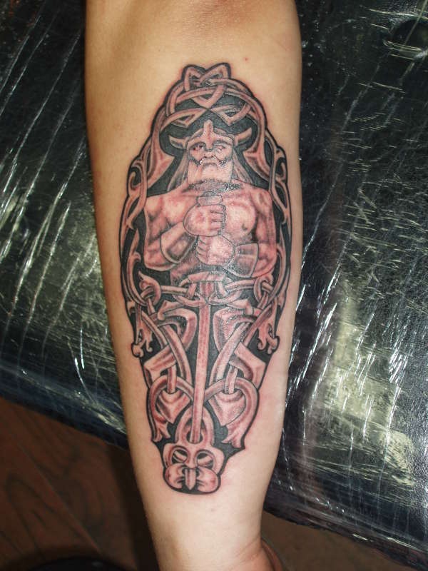 Viking tattoo of warrior with long sword