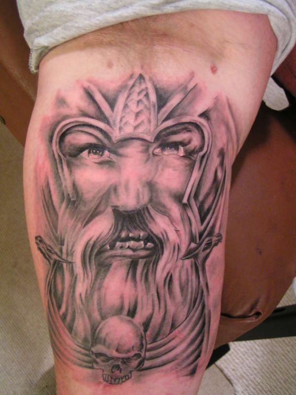 Angry viking warrior face on tattoo