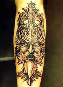 Viking tattoo of dark black warrior head