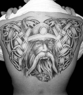 Back tattoo of viking warrior with good eyes and decoration