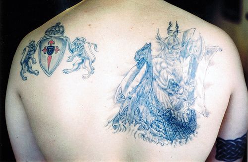 Viking tattoo with warrior on back